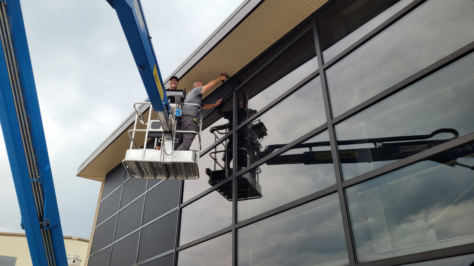 Crew installing commercial solar screens